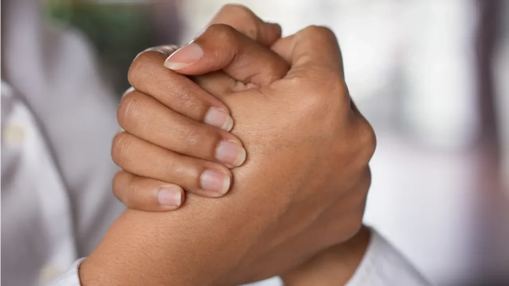 Fotografia de um aperto de não